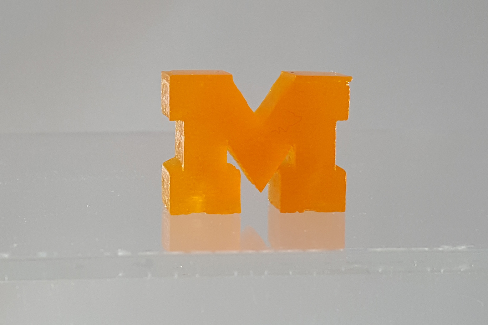 Examples of 3D printed models showcasing University of Michigan's rapid volumetric printing technology.