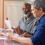 An older couple reviewing a social security benefit statement